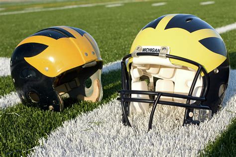 One Old, One New Wolverine Helmets on the Field Photograph by Michigan ...