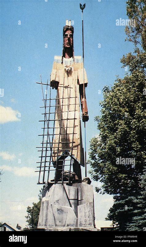 SKOWHEGAN INDIAN, 1969. /n62 feet wooden statue of a Skowhegan Indian with fishing spear and ...