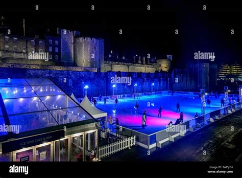 Ice skating rink at Tower of London, castle at night, London, England ...