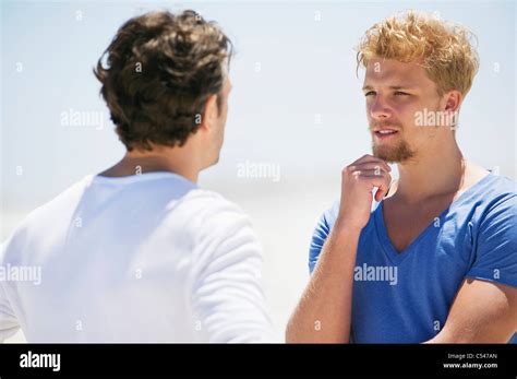 Two men talking to each other Stock Photo - Alamy