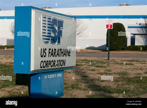 A logo sign outside of a facility occupied by the US Farathane ...