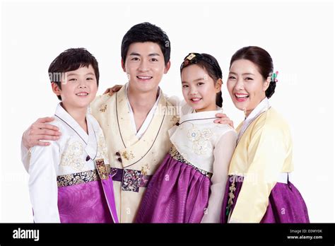 a family wearing traditional Korean outfits Stock Photo - Alamy