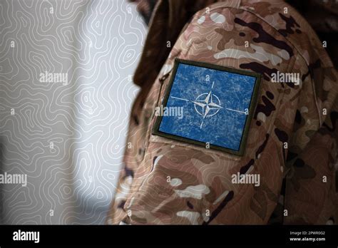 NATO Soldier. Soldier with flag NATO, NATO flag on a military uniform ...