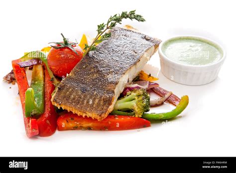 Flounder with vegetables and green sauce Stock Photo - Alamy