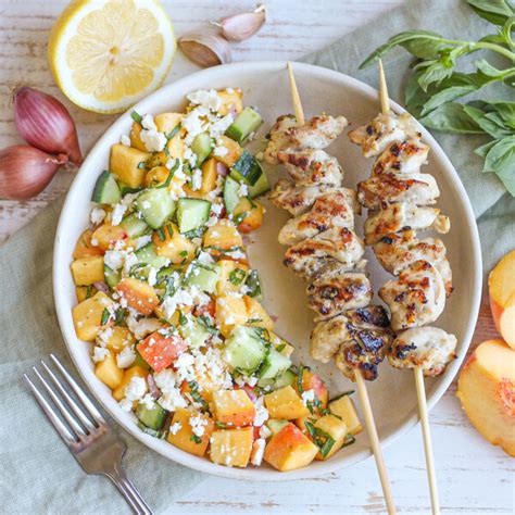 Mealime - Lemon-Garlic Chicken Skewers with Cucumber, Peach, Basil & Feta Salad