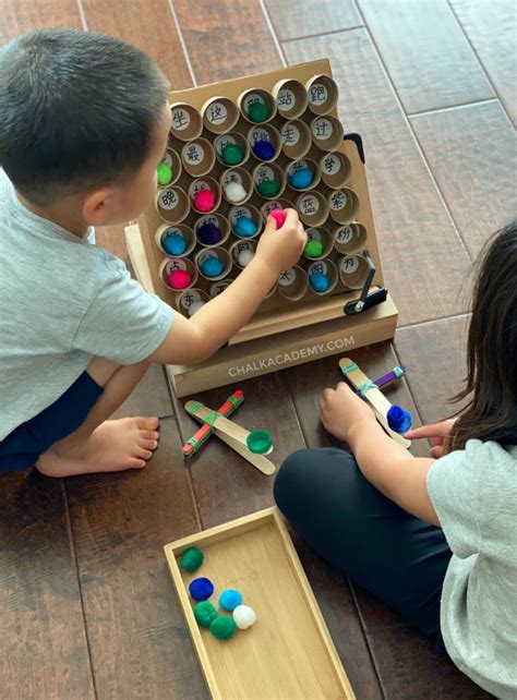 DIY Catapult Reading Game with Cardboard Sight Word Board!