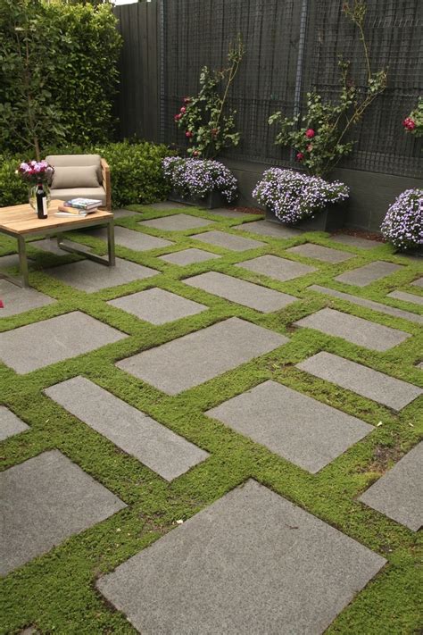 Bluestone slabs and groundcover gives a carpet effect in this cosy ...