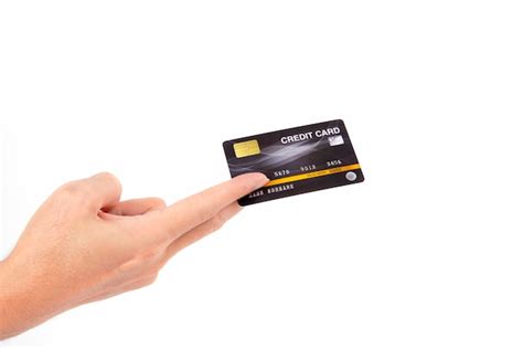 Premium Photo | Hand holding credit card isolated on white