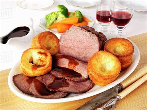 Roast beef and Yorkshire puddings (England) - Stock Photo - Dissolve