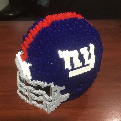 a lego football helmet sitting on top of a wooden table