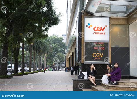 Hanoi, Vietnam - Nov 9, 2014: Sidewalk of Vincom Center in Ba Trieu Street, with People Sitting ...