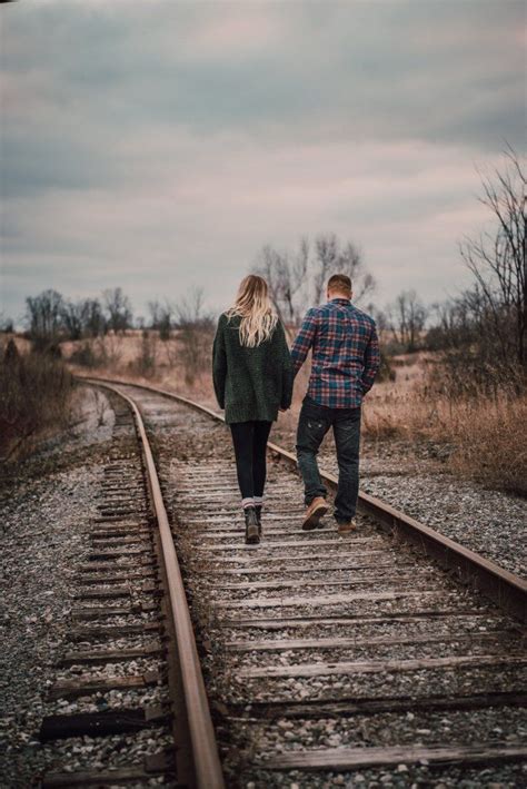 Walking down the train tracks during their country farm engagement session in Ontario. | Train ...