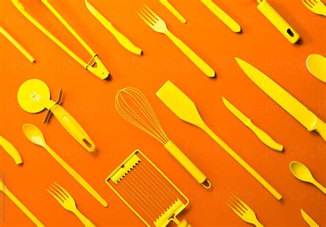 "Well Organised Yellow Kitchen Objects On Orange Background." by Stocksy Contributor "AUDSHULE ...