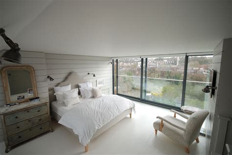 contemporary loft conversion bedroom with full width sliding glass doors Loft Conversion Bedroom ...