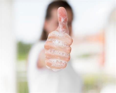 Premium Photo | Person washing hands with soap