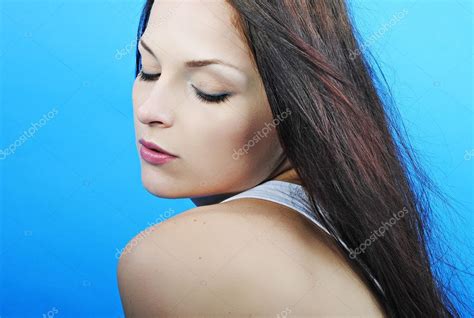 Beautiful girl brunette with long hair looks downwards - Stock Photo ...