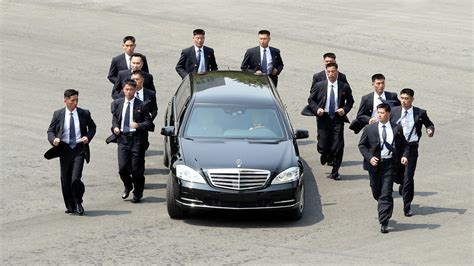 Kim Jong Un's jogging bodyguards run alongside leader's limo at inter ...