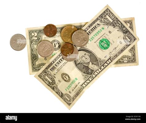 small crumpled dollar bills and coins isolated on white background ...