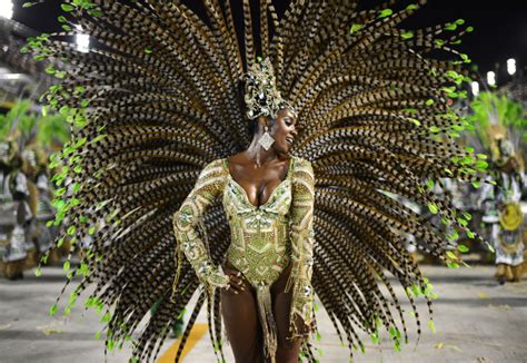 Gold and feathered samba dancers spice up Carnival celebrations in Rio