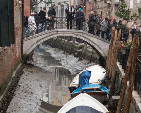 Drought And Low Tides Cause Venetian Canals To Run Dry