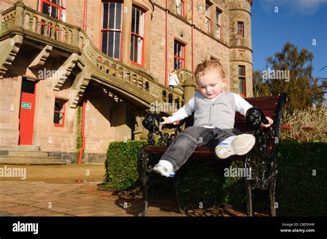 a young child posing for portrait around belfast castle northern ireland Stock Photo - Alamy