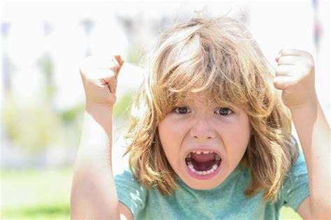 Premium Photo | Child with angry expression angry hateful little crazy boy child furious angry ...