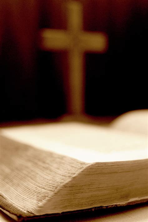 Bible With Blurred Cross In Background A Photograph by Jacek Wojnarowski - Pixels