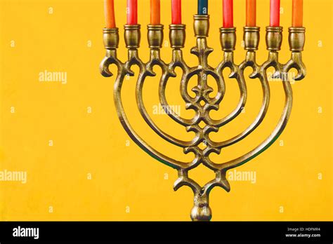 Hanukkah menorah with candles on the yellow background horizontal Stock Photo - Alamy