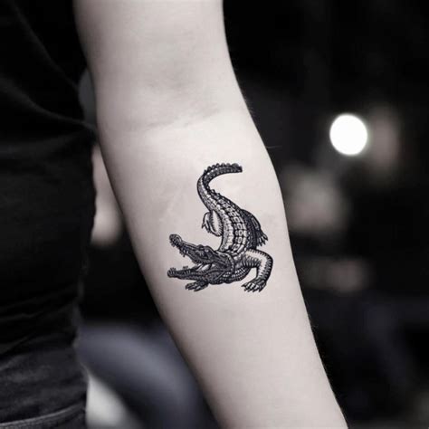 small alligator tattoo - Google Search | Alligator tattoo, Crocodile tattoo, Fake tattoos