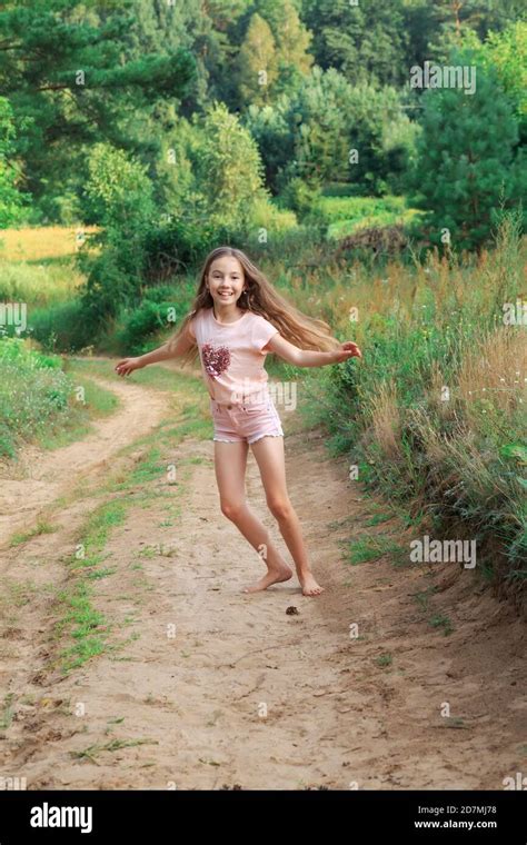 Beautiful teen girl Is dancing outside at summer sunset Stock Photo - Alamy