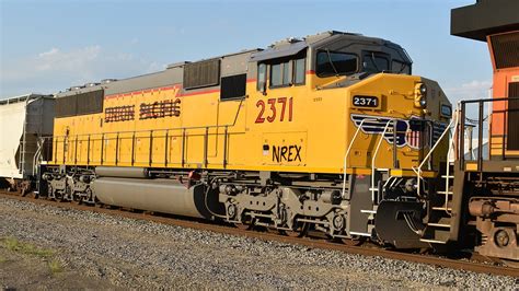 NREX 2371, a former UP SD60M, trails on BNSF LCHI6571 - YouTube