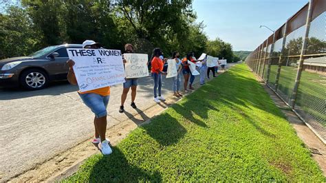 Dozens gather outside Eddie Warrior demanding better care for inmates with COVID-19