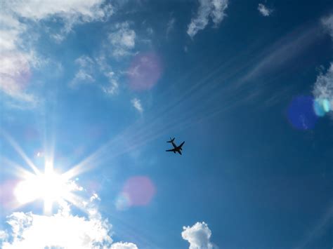 Free Images : horizon, bokeh, cloud, sky, sun, sunlight, fly, aircraft, blue, freedom, clouds ...