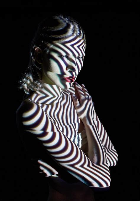 Woman In Abstract Lighting Looking To Photograph by Mads Perch - Fine ...