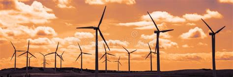 Wind Turbine Field at Sunset, Dramatic Sky Stock Photo - Image of ...