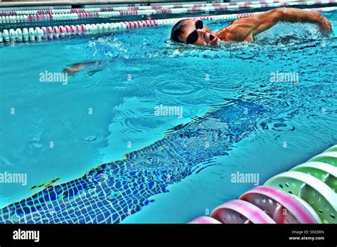 Closeup. Male athlete swimming freestyle Australian crawl. Outdoor ...