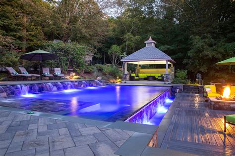 Award Winning Swimming Pool with Negative Edge, Waterfall, and Fire Pit. Custom Swimming Pool ...