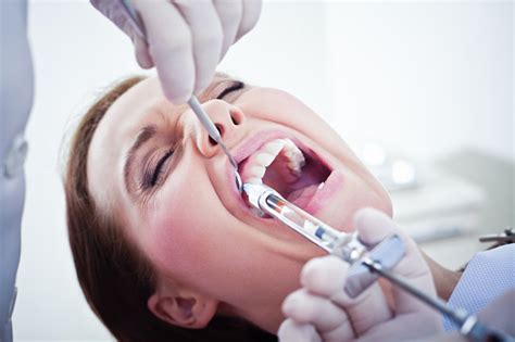 Painful Dental Procedure With Injection Needle Stock Photo - Download Image Now - iStock