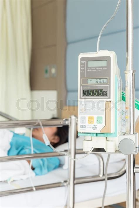 Female patient with IV drip needle ... | Stock image | Colourbox