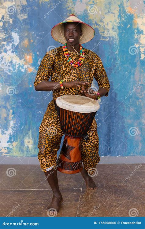 African Man in Traditional Clothes Playing Djembe Drum Stock Photo ...