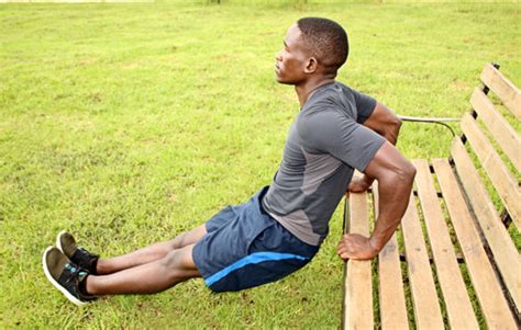 Man Doing Triceps Bench Dips Outdoors With Straight Legs - High Quality Free Stock Images