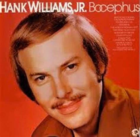 Stop What You're Doing & Watch A Young, Mustachioed Hank Jr. Perform 'The Kind Of Woman I Got'