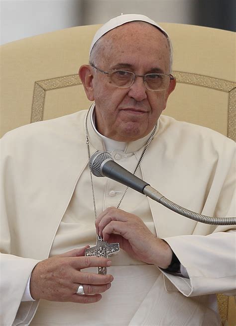 Pope Francis holds pectoral cross as he leads general audience in St ...