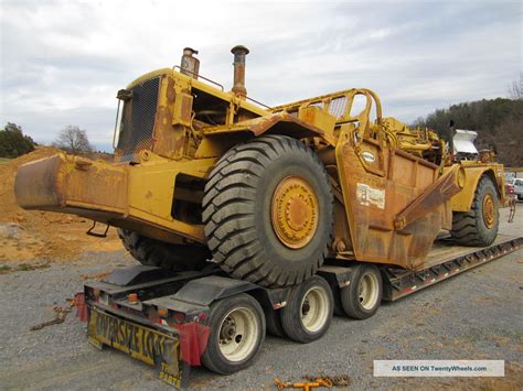 (two) 1984 & 1985 Caterpillar 627b Push Pull Scrapers