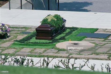 The casket for Jacqueline Bouvier Kennedy Onassis is placed next to ...