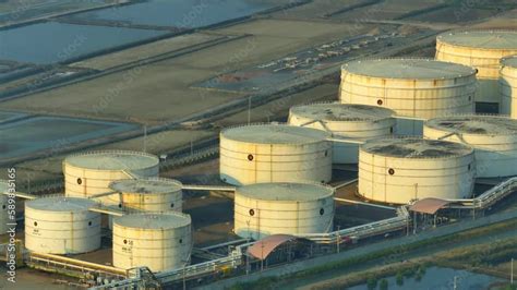 From an aerial view, an oil depot usually appears as a large industrial ...