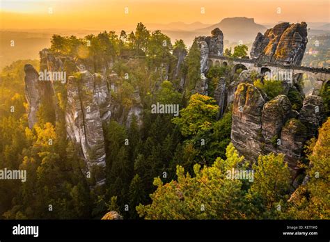 View of Bastei bridge, Bastei at sunrise, in the back the Lilienstein ...