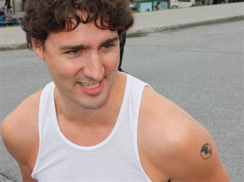 Prime Minister Justin Trudeau flashes his raven tattoo | Daily Mail Online