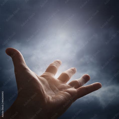 Hand reaching for the cloud in the sky Stock Photo | Adobe Stock