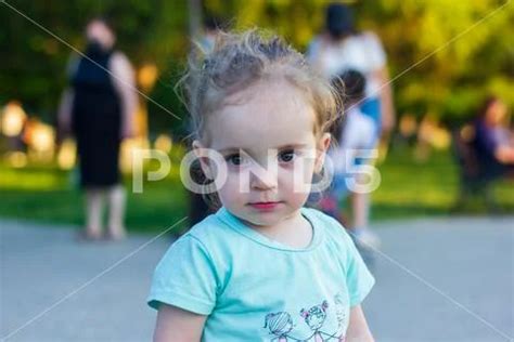 Little girl in a park, little girl walking in the park ~ Premium Photo ...